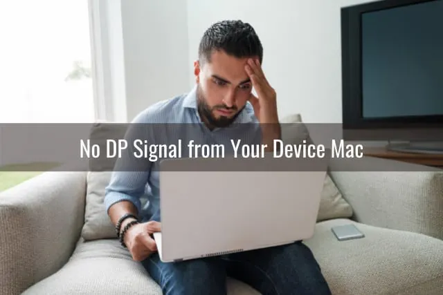 Frustrated man holding a laptop