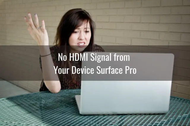 Frustrated woman holding a laptop