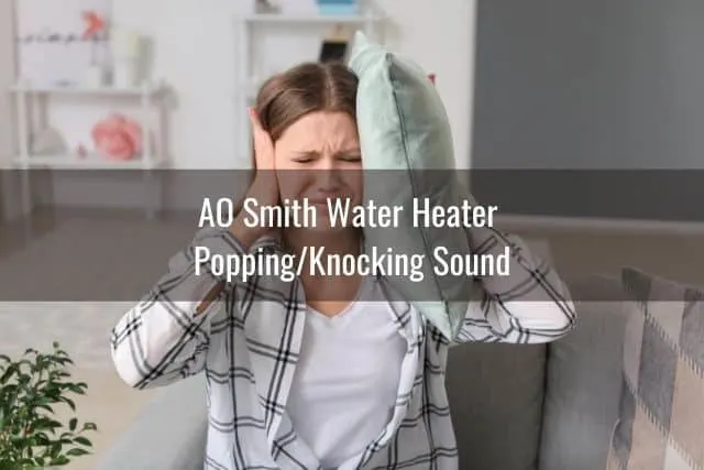 Female covering ears with hands and pillow