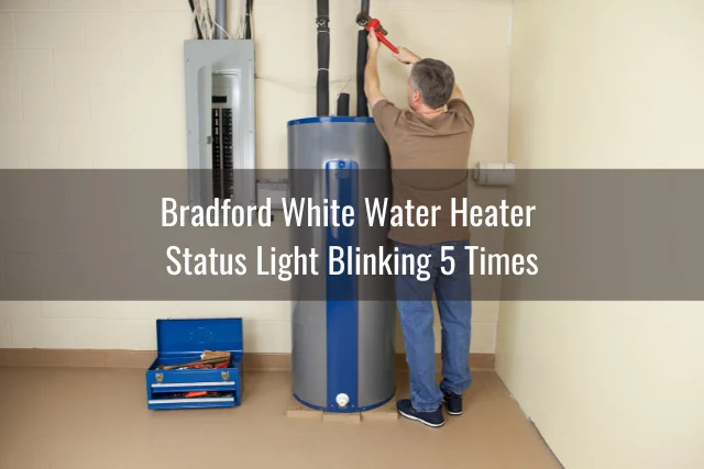 Man fixing the water heater tank