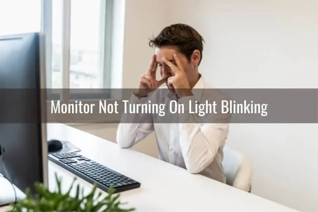 Man frustrated looking at his monitor
