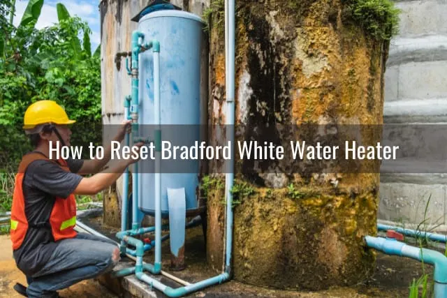 Man checking the water heater tank