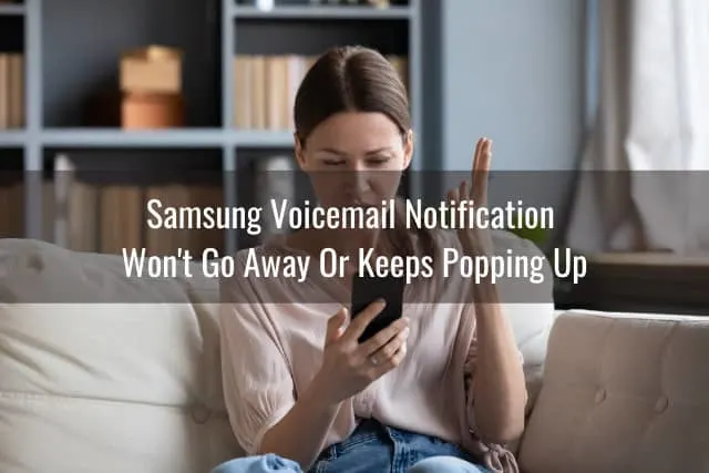 Frustrated woman looking at her phone