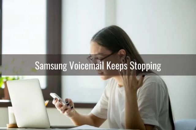 Frustrated woman looking at her phone