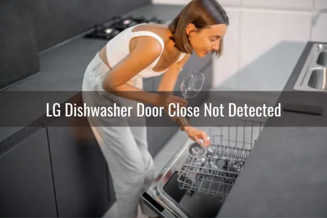 Woman checking the dishwasher