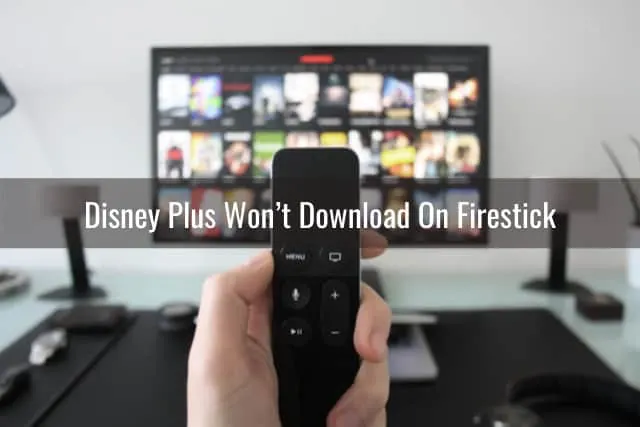 Holding a remote while point at the tv
