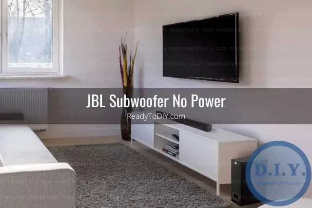 Black subwoofer below the flatscreen tv