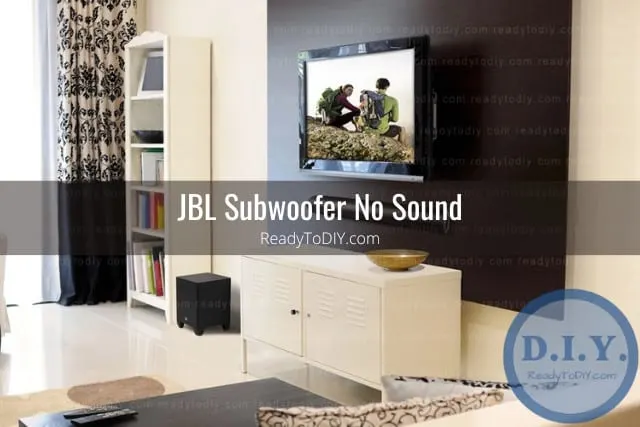 Black subwoofer below the flatscreen tv