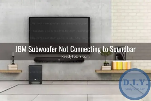 Black subwoofer below the flatscreen tv