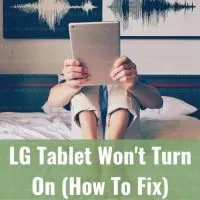 Female on bed with tablet PC in her face