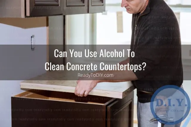 Man fixing the concrete countertops