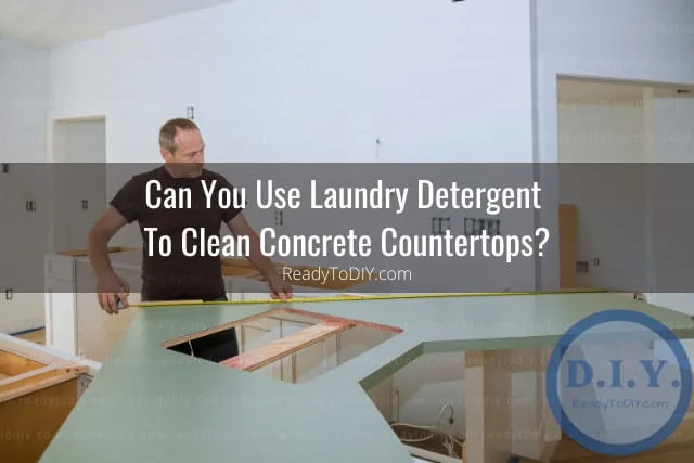 Man fixing the concrete countertops