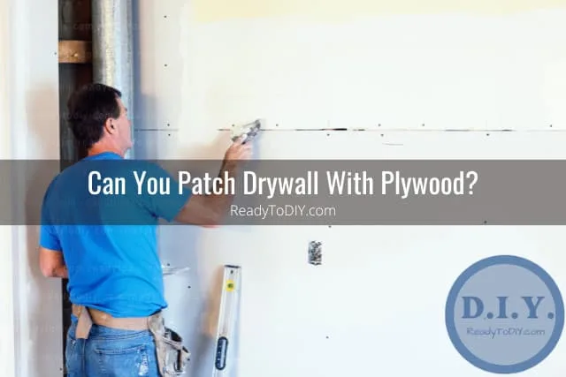Man fixing the drywall