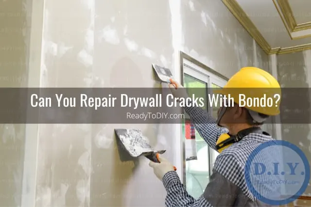 Man fixing the drywall