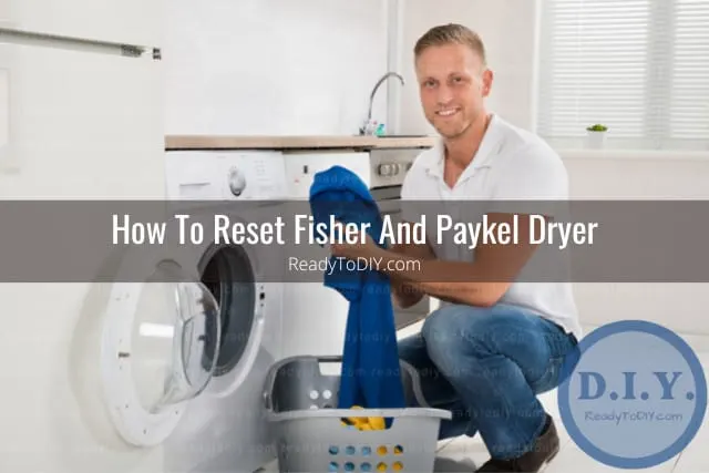 Man putting clothes inside the dryer