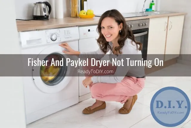 woman putting clothes inside the dryer