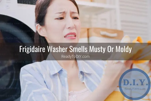 Woman smelling the clothes from the washer