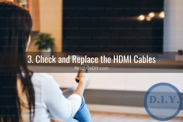 Holding a remote while point at the tv