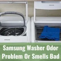 White modern washer with clothes