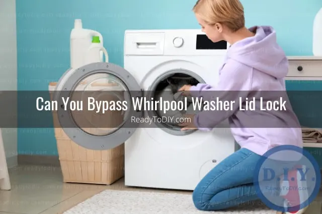 Modern white washer with clothes inside