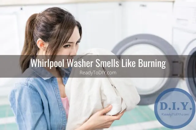 White modern washer with clothes
