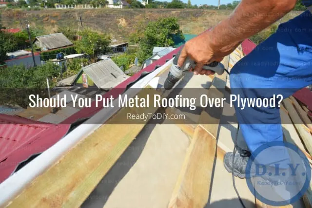 Man fixing the metal roofing