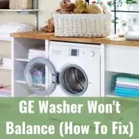 White modern washer with clothes
