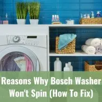 Modern white washer with clothes inside