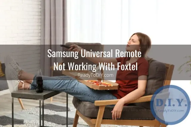 Holding a remote while point at the tv
