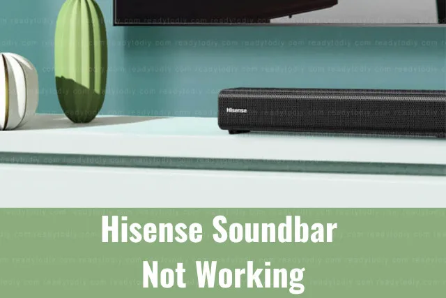 Black soundbar below the flatscreen tv