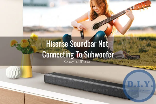 Black soundbar below the flatscreen tv