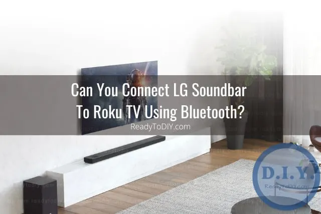 Black soundbar below the flatscreen tv
