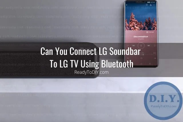 Black soundbar below the flatscreen tv