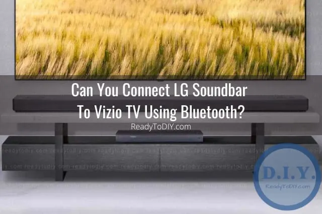 Black soundbar below the flatscreen tv