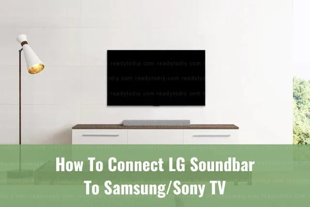 Black soundbar below the flatscreen tv