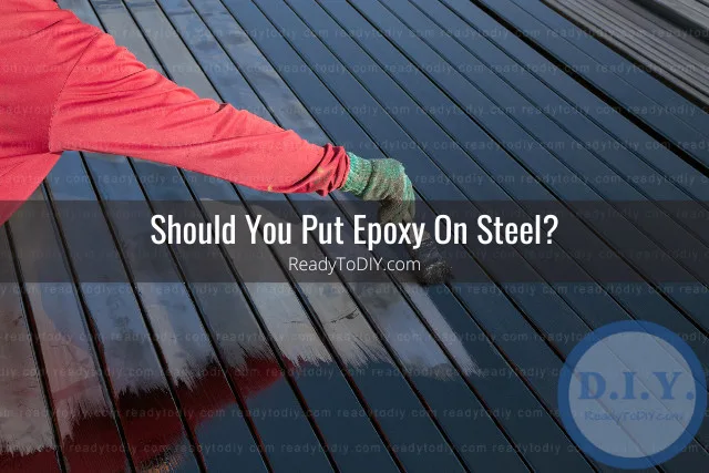 Man painting steel using epoxy