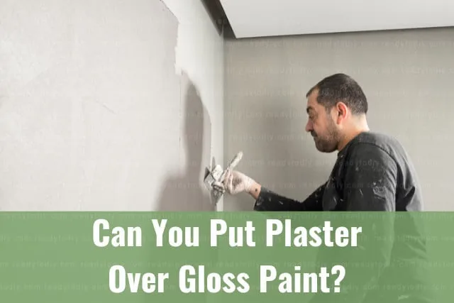 Man putting plaster on the wall