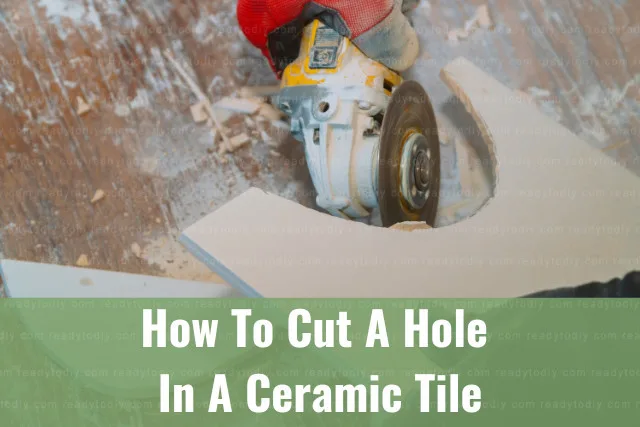 Man cutting ceramic tile in hole