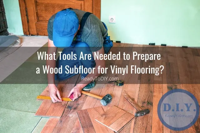Man installing wood subfloor