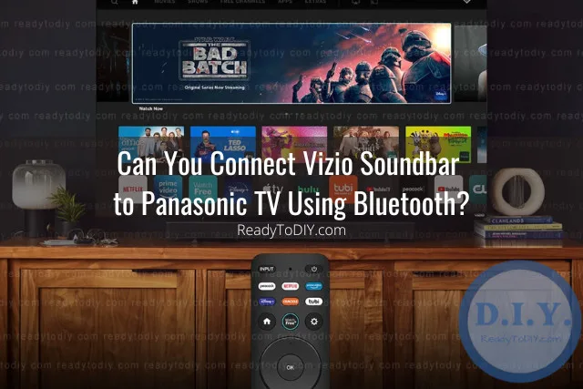 Black soundbar below the flatscreen tv