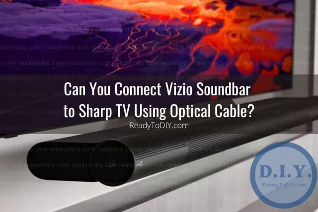 Black soundbar below the flatscreen tv