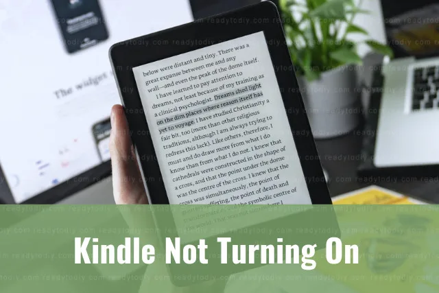 Holding black kindle while reading