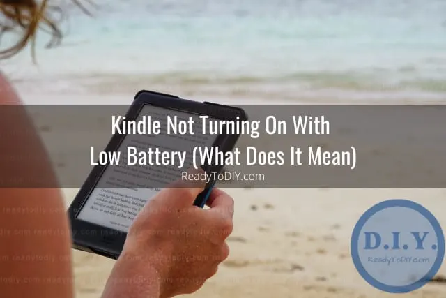 Holding black kindle while reading