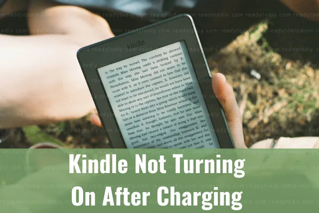 Holding black kindle while reading