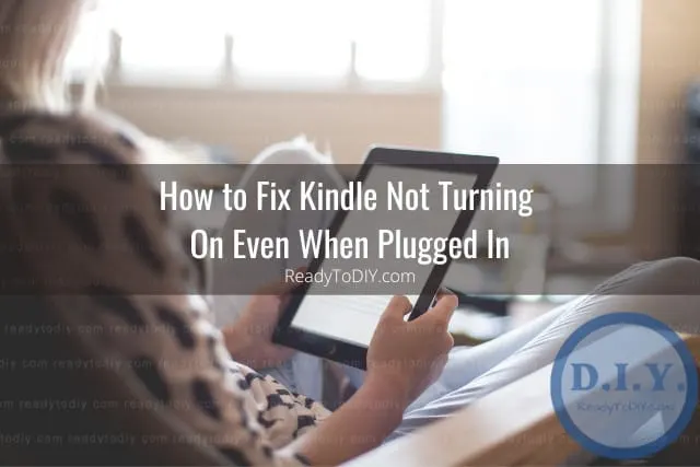 Holding black kindle while reading