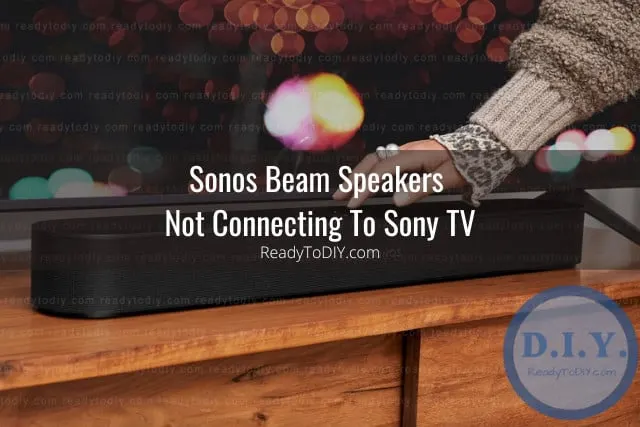 Black latest speaker below flatscreen tv