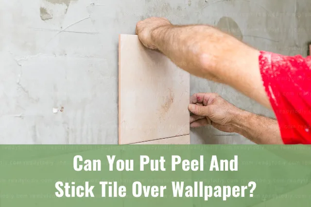 man installing tiles at the wall