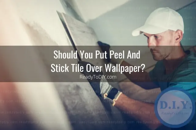 man installing tiles at the wall