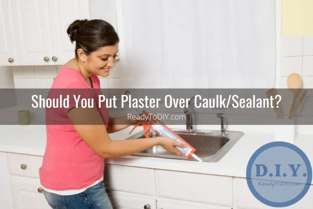 Man putting plaster on the side of the kitchen faucet