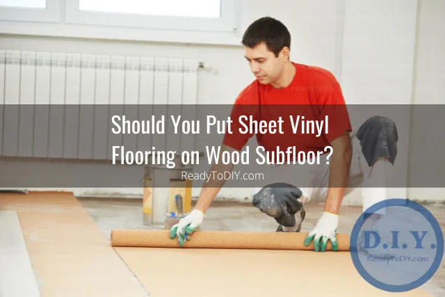 Man putting roll flooring